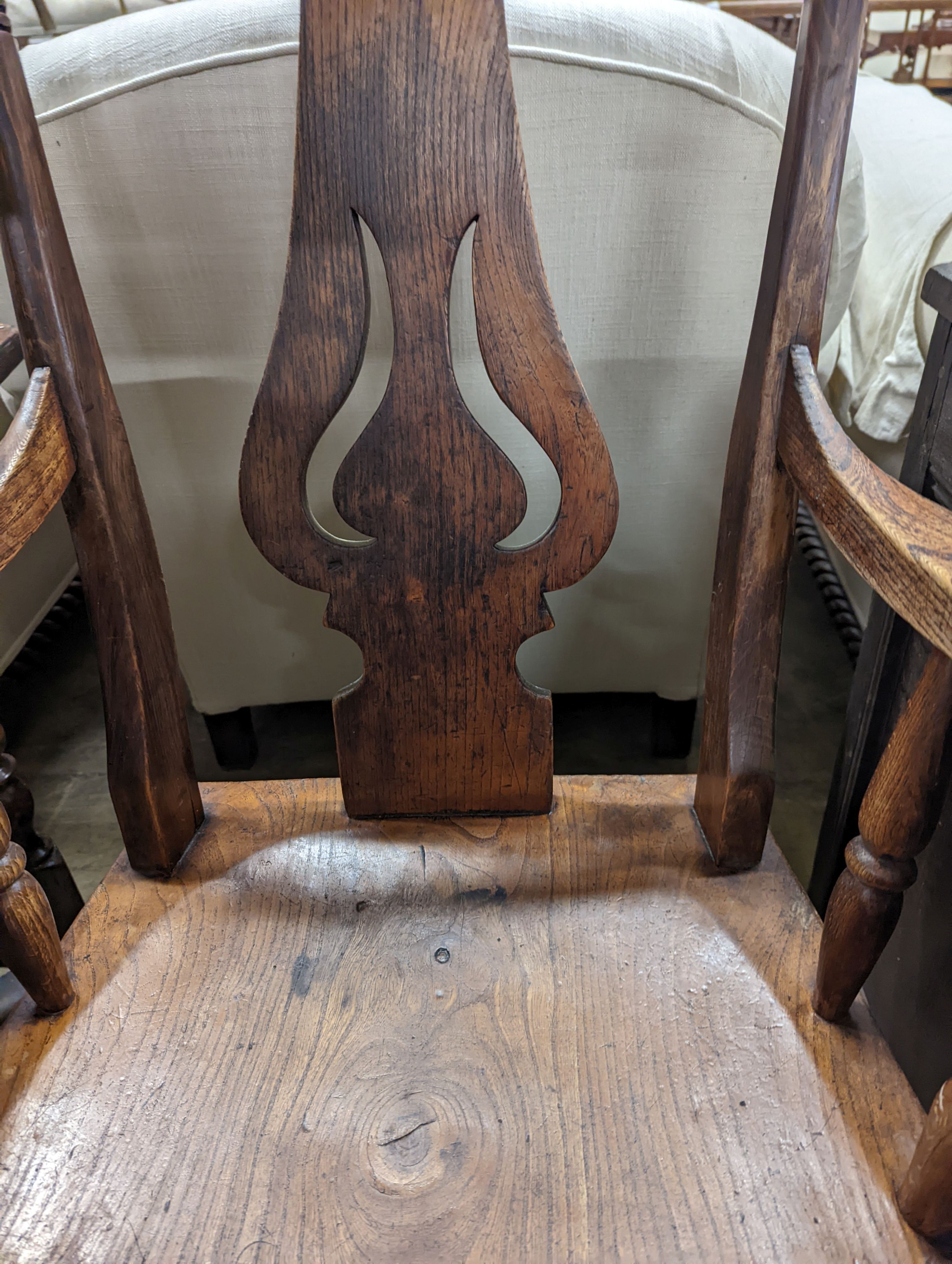 A Victorian elm and beech Windsor armchair with pierced splat stamped J D 33, width 56cm, depth 43cm, height 112cm